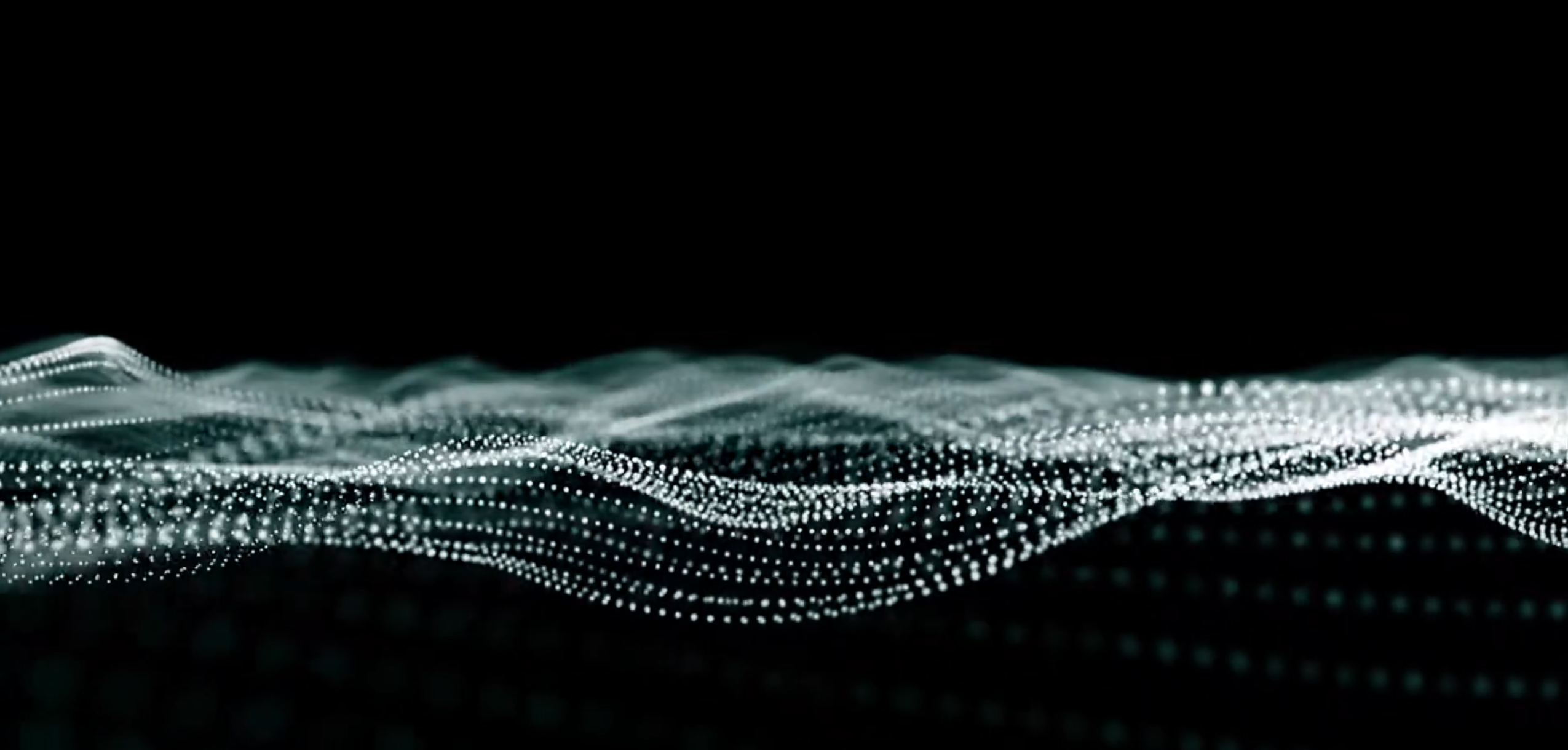 Person sitting on couch working on laptop