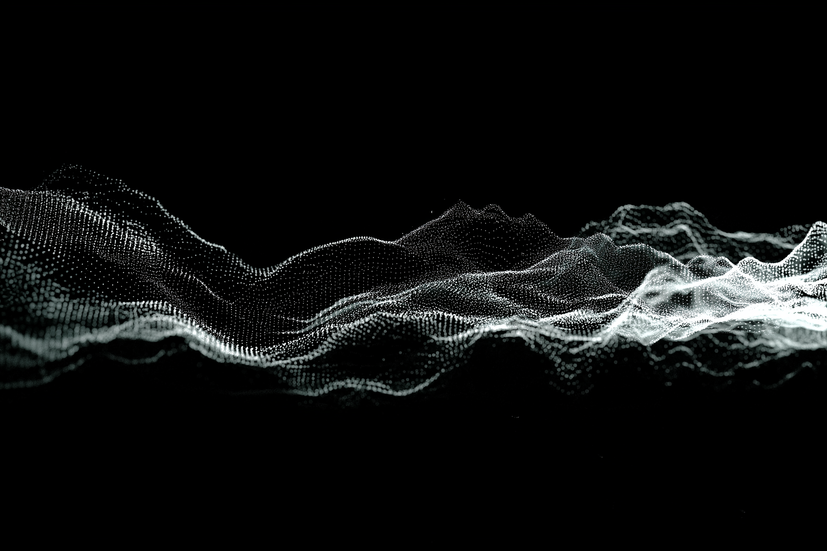 Person at standing desk working on laptop